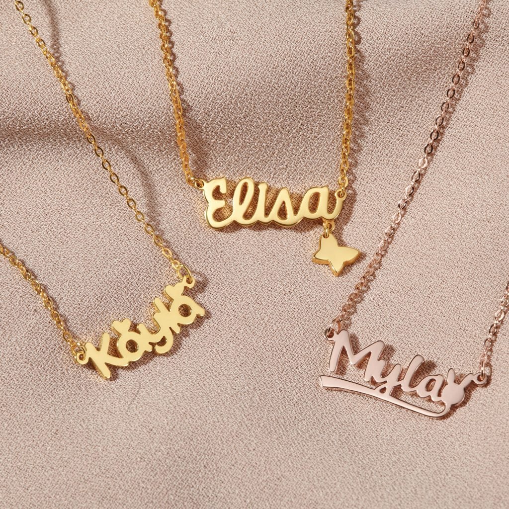 img src="necklace.png" alt="three name with charms necklaces in yellow and rose gold color"