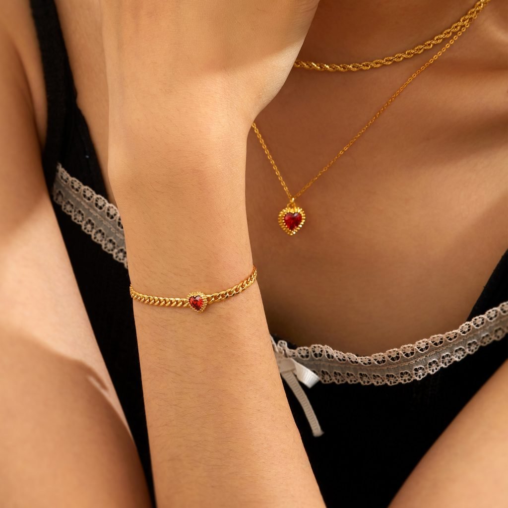 img src="heartnecklaceandbracelet.png" alt="heart shaped necklace and bracelet in silver yellow or rose gold plating"