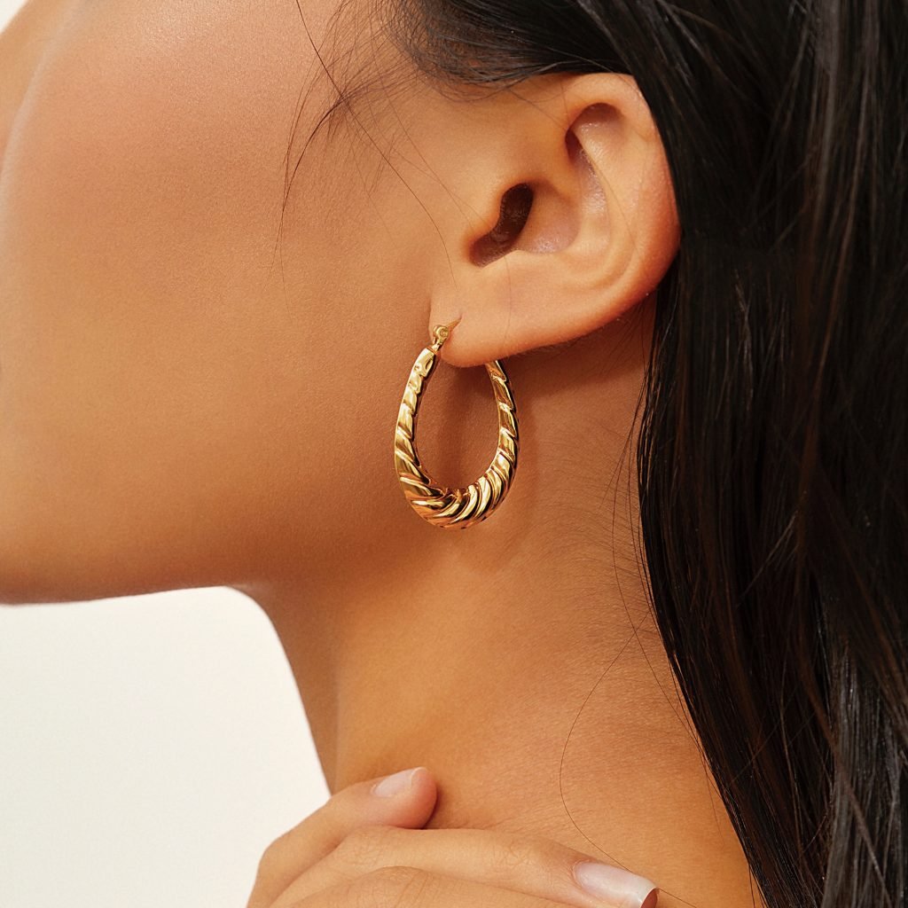 img src="earrings.png" alt="twist hoop earrings in gold color like a heavenly croissant" 